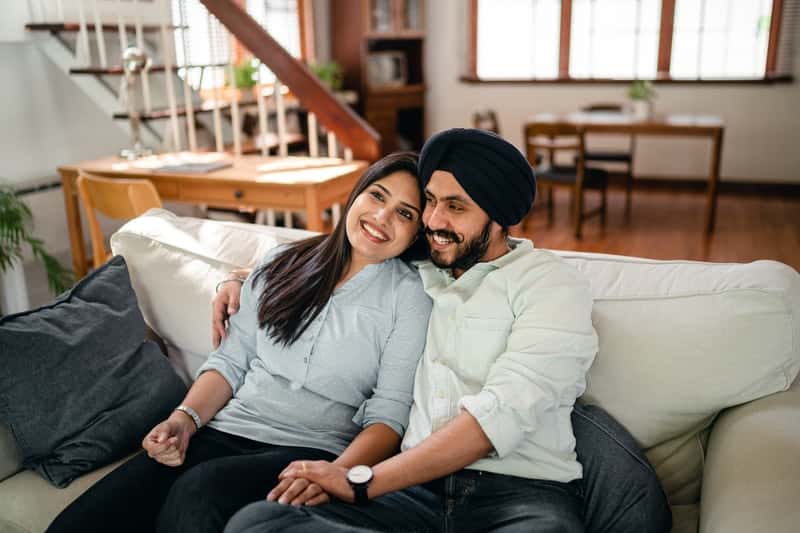 Couple on couch happy they got a penis sleeve