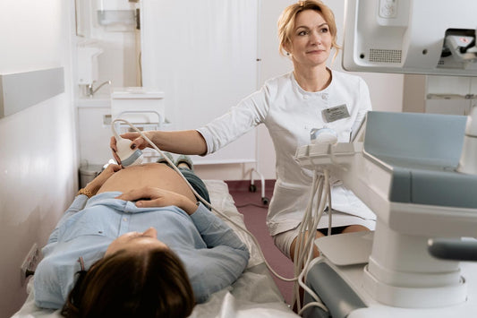pregnant woman lying on table getting an ultra sound