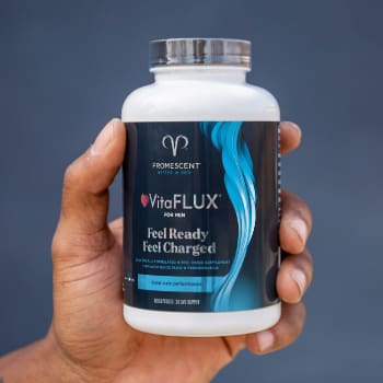 VitaFLUX Nitric Oxide Booster in persons hand