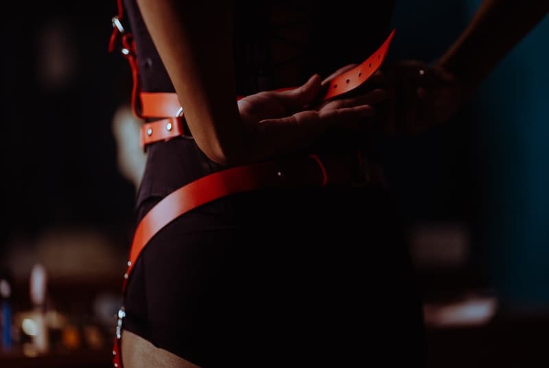 Woman dressing for BDSM session