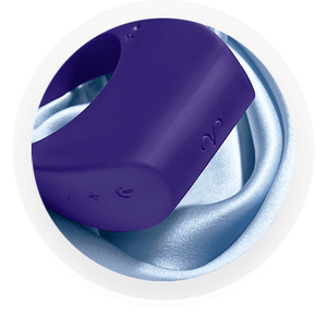 Promescent pensi ring sitting on blue sating sheet